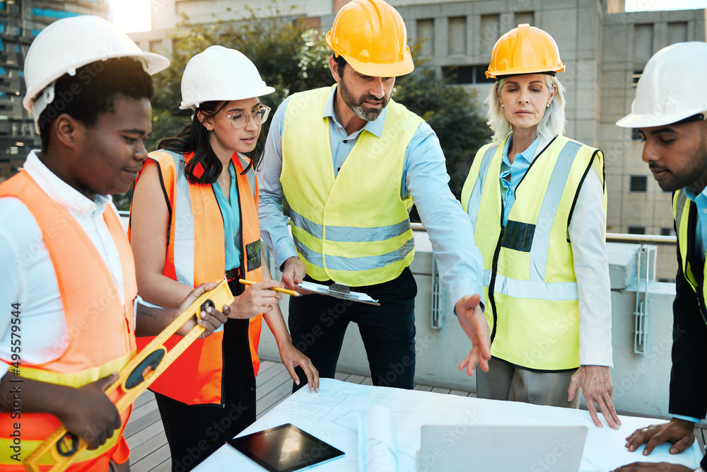 Poster we have a lot to get through. shot of a diverse group of contractors standing outside together and h