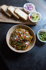 Popular Indian street food ghugni or yellow peas masala served in bowl. Top view.