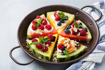 Watermelon pizza with berries, fruit, yogurt, feta cheese