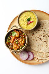 vegetarian Indian thali or Indian home food with lentil dal, cauliflower curry, roti or Indian flat bread  