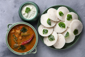  Traditional breakfast of South India Idly served with sambar Chutney in a ceramic plate