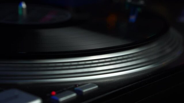 Vinyl Record Spinning on Gramophone, Night Club Disco Lights and Vintage Music, Close Up