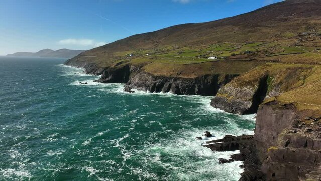 Ventry, Kerry, Ireland, March 2022. Drone pushes west along the Dingle Way following the craggy coastline with the Blasket Islands and North Atlantic Ocean in the distance.