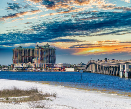 Bridge to Destin and city hotels under a sunset winter sky, Florida.