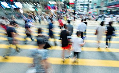 Crowd of people walking on busy hong kong street
