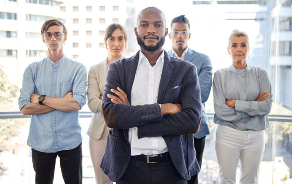 We are capable and unstoppable. Portrait of a group of businesspeople standing with their arms crossed in an office.