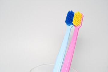 A conceptual of a couple toothbrush in love. Toothbrushes convey the human relationship between a man and a woman.