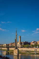 Fototapeta na wymiar View to the Franco monument at the Ebro river in Tortosa, Catalonia, Tarragona, Spain. vertical