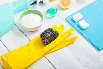 dishwashing products on white wood table