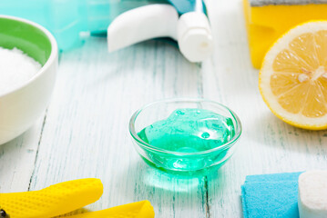 dishwashing products on white wood table