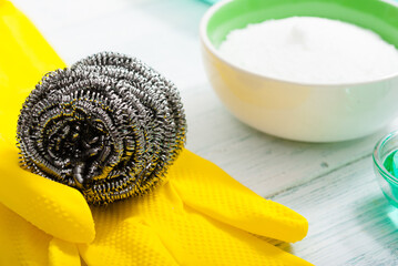 dishwashing products on white wood table