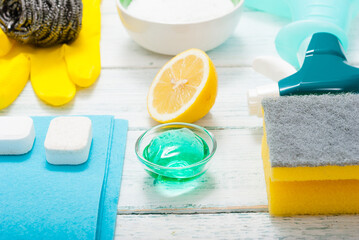 dishwashing products on white wood table