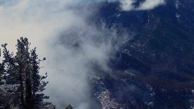 Cold winter clouds swirl above the Sandia mountains near Abuquerque.