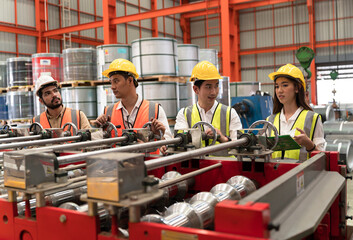Teamwork engineer or foreman hard work with machine at factory	