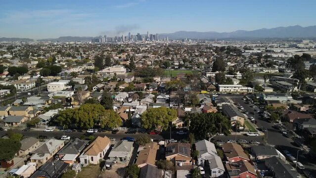 4k cinematic drone footage over South Central Los Angeles with Black Cloud over downtown Los Angeles