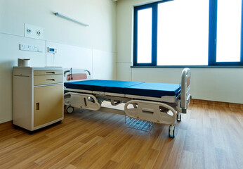 Empty bed in hospital ward