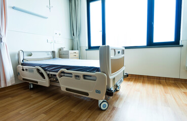 Empty bed in hospital ward