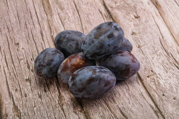 Purple sweet ripe plum heap
