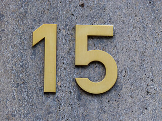 Metal home number on a wall