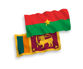 National vector fabric wave flags of Sri Lanka and Burkina Faso isolated on white background. 1 to 2 proportion.