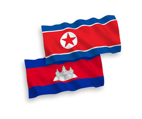 National vector fabric wave flags of North Korea and Kingdom of Cambodia isolated on white background. 1 to 2 proportion.