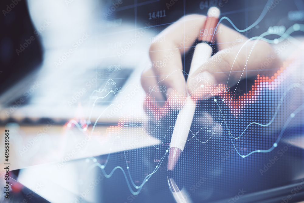 Poster close up of businessman hand pointing at tablet with abstract red forex chart index on blurry backgr
