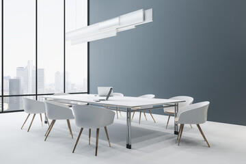 Fototapeta na wymiar Bright concrete meeting room interior with window and city view, furniture, ceiling lamp and laptop device on table. Workplace and conference concept. 3D Rendering.