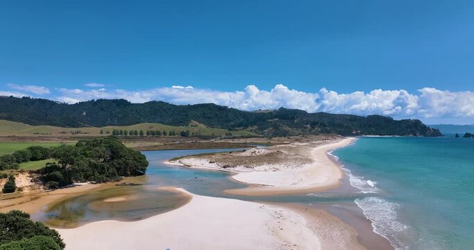 Flying over sunny Otama Beach towards pristine Otama River - New Zealand
