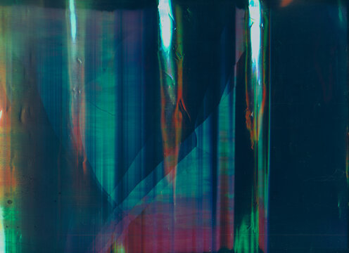 Screen damage. Digital glitch error. Colorful glow on teal blue background.