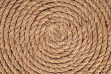 Twisted natural rope, background. Texture. Coiled rope, close-up.