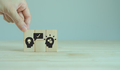Suggestion and consulting concept. New idea, solution. Putting wooden cubes with recommend to advise someone icon on grey background. Business review, strategy suggestion for business developement.