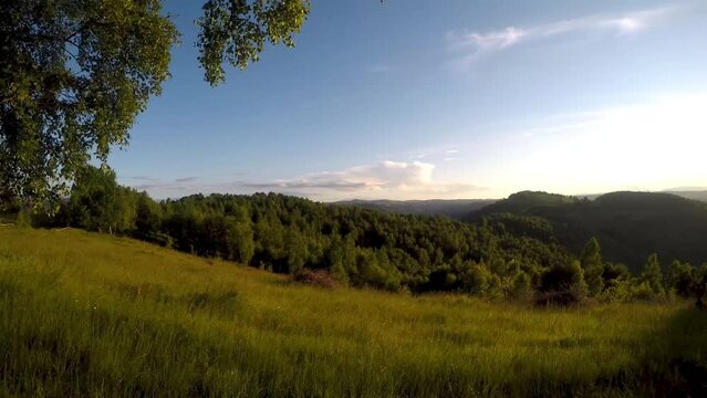 Time lapse video over the sunset in the mountains.