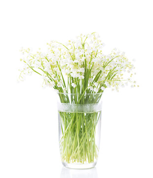 Bouquet of Lilies of the Valley isolated on white background. Selective focus.