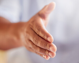 Put er there. Cropped shot of an unrecognizable businessman gesturing for a handshake while standing in his office.