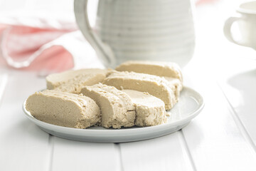 Sweet tahini halva. Turkish dessert on plate.