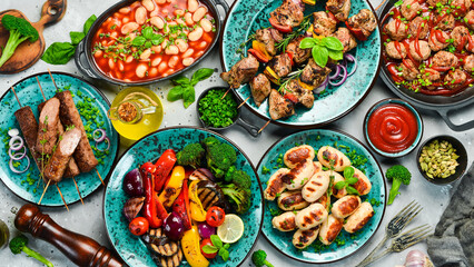 Food background. Set of traditional Turkish and Oriental cuisine. Set of meat and vegetable dishes in plates. Top view. On a stone background.