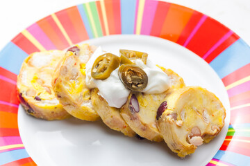 bean dumplings with sour cream and jalapenos