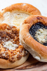 pies stuffed with poppy, curd and nuts filling
