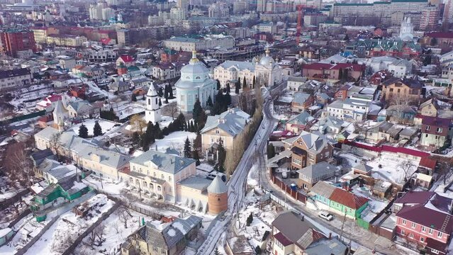 Winter aerial view of snow covered historic district of Voronezh city with Orthodox Alekseev-Akatov Monastery in Russia