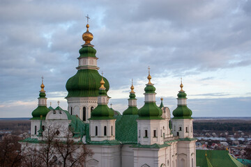 Fototapeta na wymiar Church domes of Holy Trinity Monastery in Chernihiv, Ukraine. View from the belfry. Chernihiv is one of oldest cities in Ukraine.