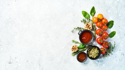 Gray stone cooking background. Spices and vegetables. Top view. Free space for your text.