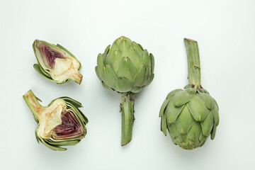 Obraz premium Concept of healthy food with artichoke on white background