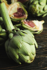 Obraz premium Concept of healthy food with artichoke on wooden background