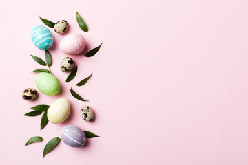 Colorful Easter eggs with spring flower leaf isolated over white background. Colored Egg Holiday...