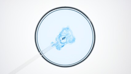 Top view macro shot of lab dropper injects dark blue liquid into light blue one in petri dish on...