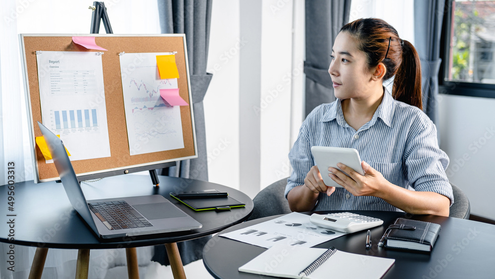 Aufkleber business woman holding tablet to checking email and reply information to boss while looking data on 