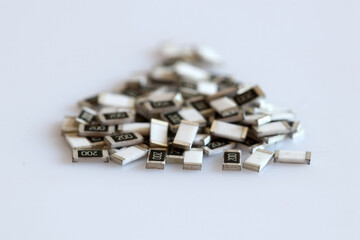 SMD resistors isolated on white background. On the body inscription value 20 Ohm