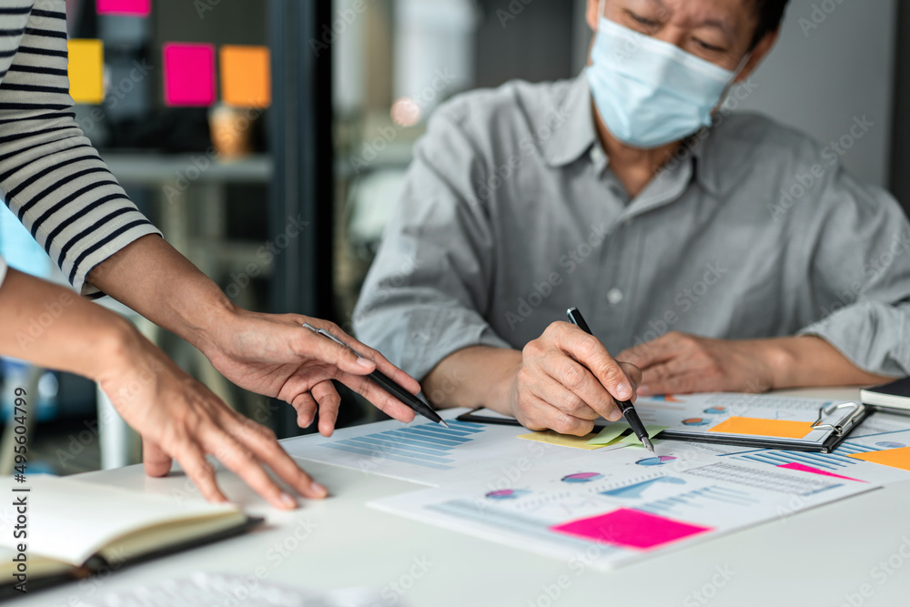 Poster Business team pointing on chart of business report to brainstorming about planning strategy of business and discussing