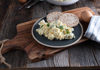 Protein snack with cottage cheese, boiled eggs, chives and brown rice cracker