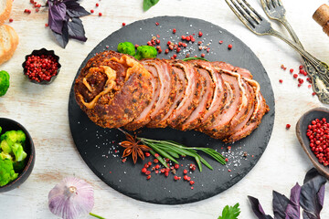 Baked pork roll with mustard and spices. Top view. Rustic style.